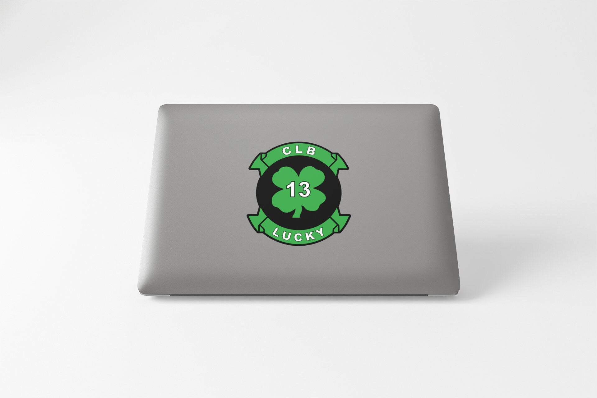 a laptop that has a clover on it