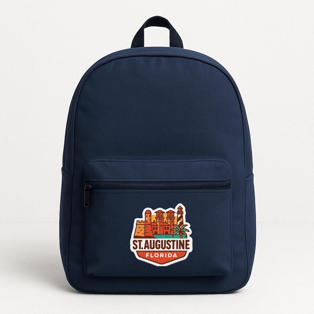 A navy blue backpack with a sticker on the front that says "St. Augustine, Florida".