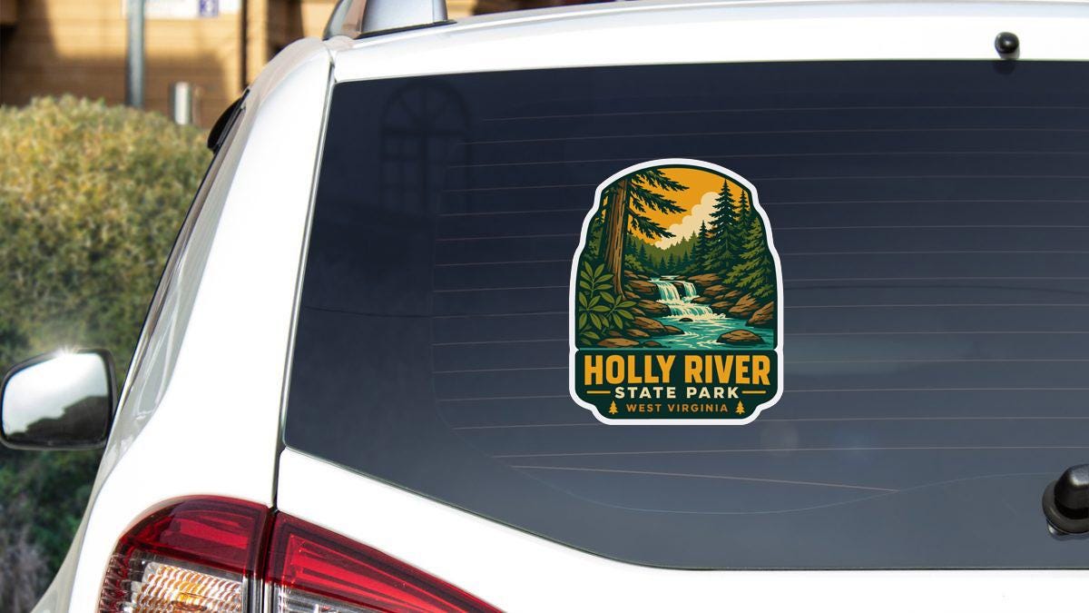 A sticker on the rear window of a white car, depicting a scenic landscape with a waterfall and pine trees.