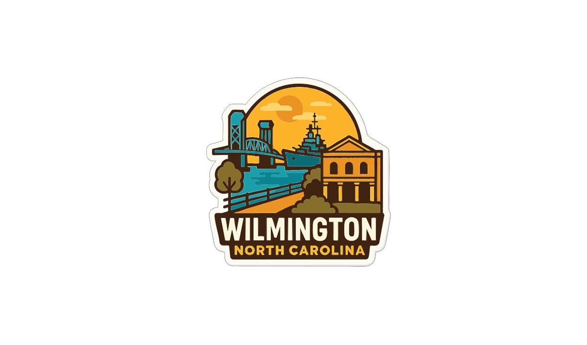 A sticker or logo depicting a cityscape with a bridge, buildings, and a sunset in the background, along with the text "WILMINGTON NORTH CAROLINA".