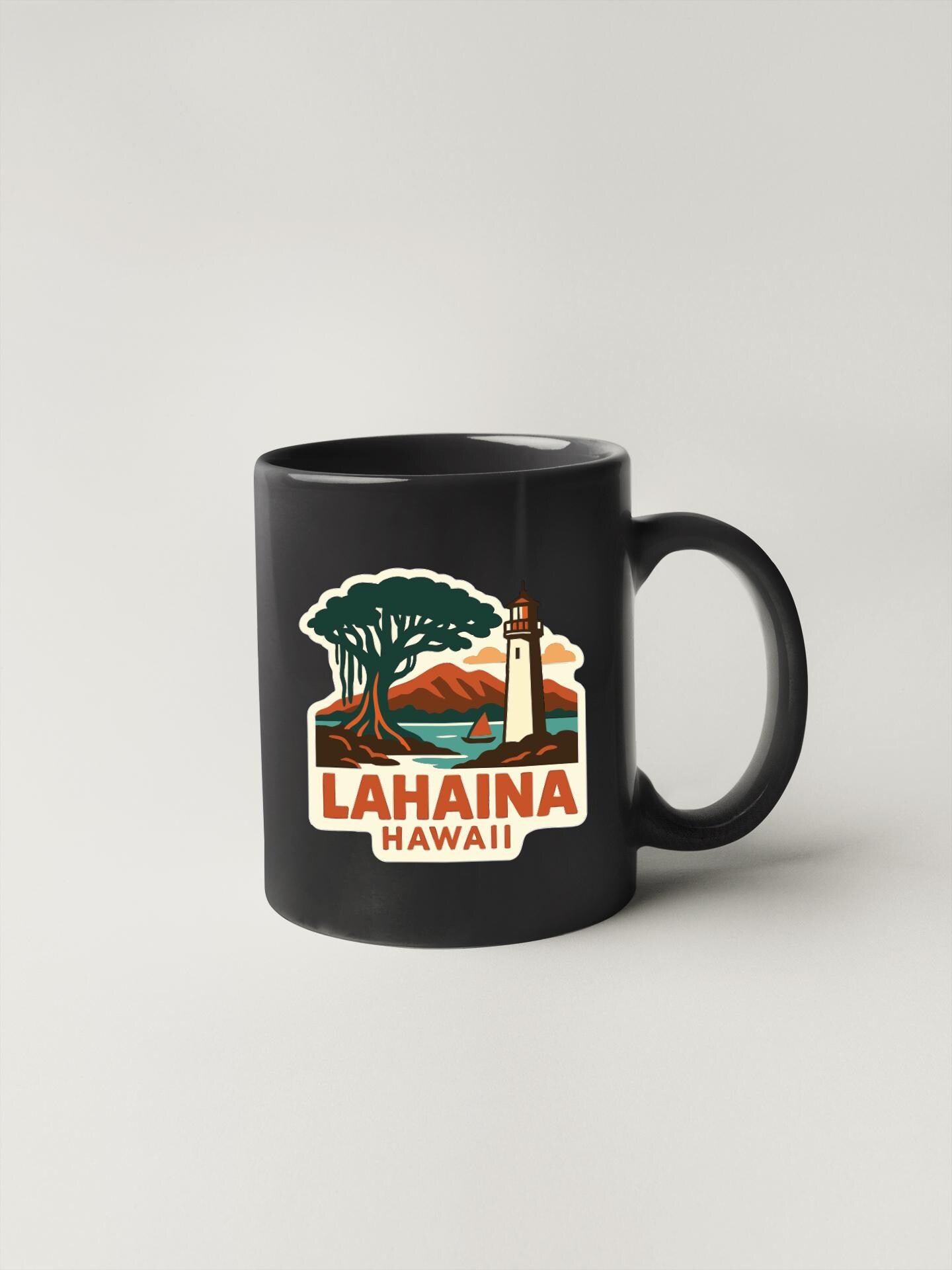 A black coffee mug with a vintage-style illustration of a lighthouse and a tropical landscape, along with the text "LAHINA HAWAII" printed on it.