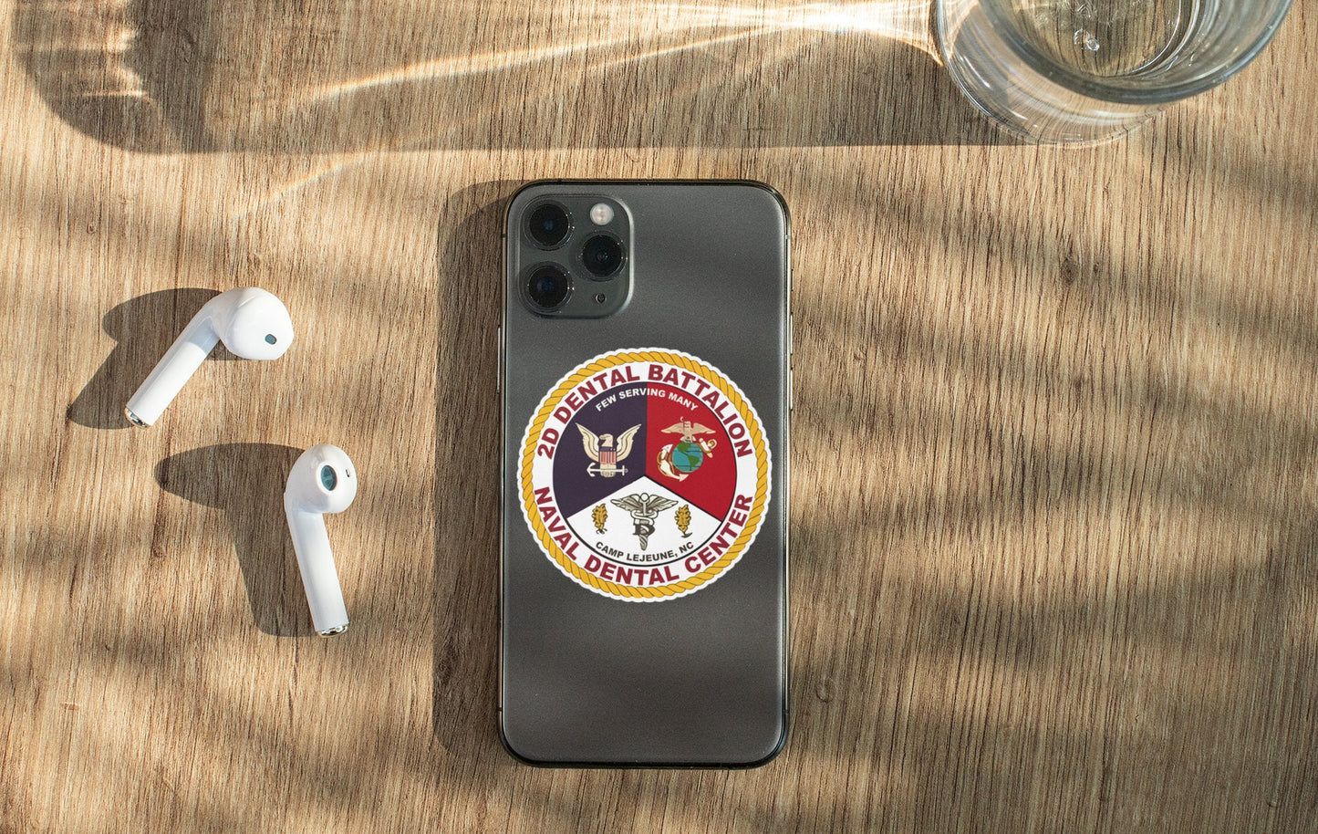 a phone and ear buds sitting on a table