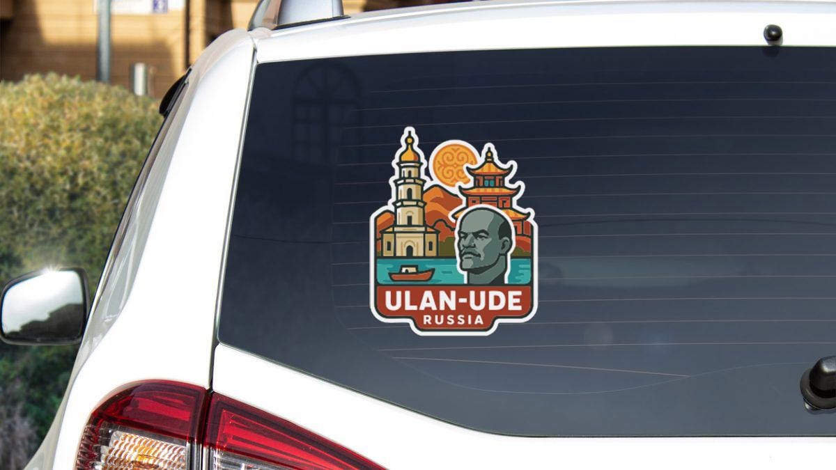A sticker on the rear window of a car, depicting a man's face and a city skyline.