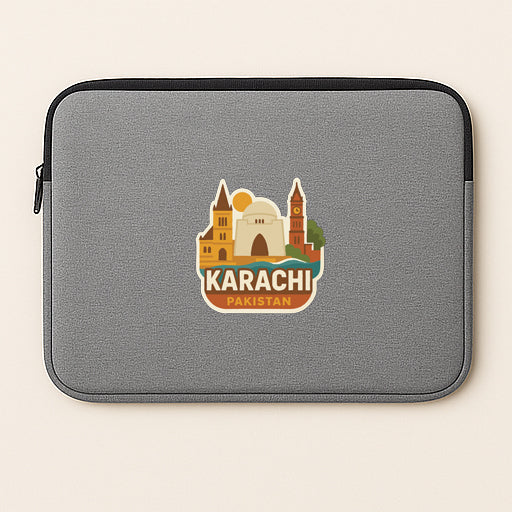 A gray laptop sleeve with a sticker depicting the skyline of Karachi, Pakistan.