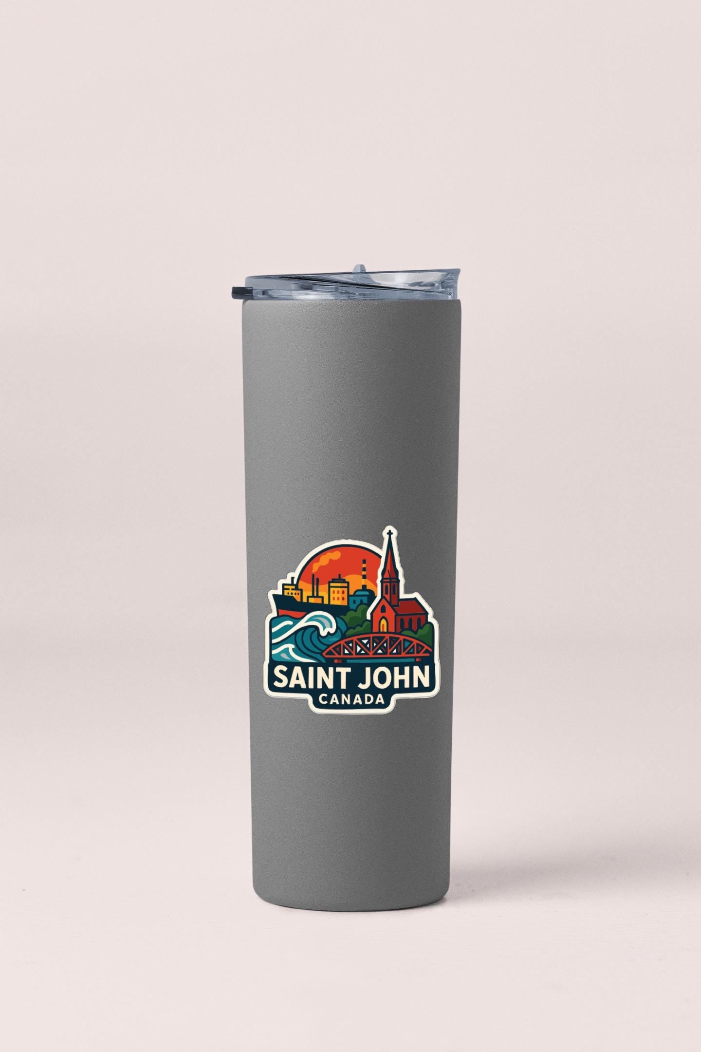A gray insulated tumbler with a printed logo that says "SANT JOHN CANADA".