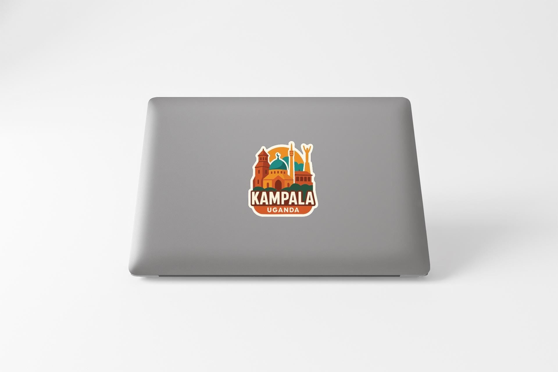 a sticker or decal of Kampala, Uganda, on the back of a laptop.