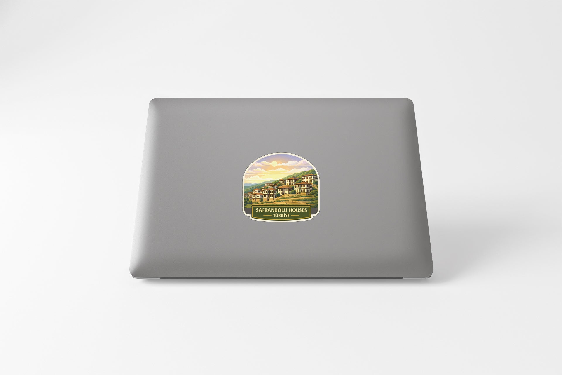 a sticker with a scenic landscape on a laptop.