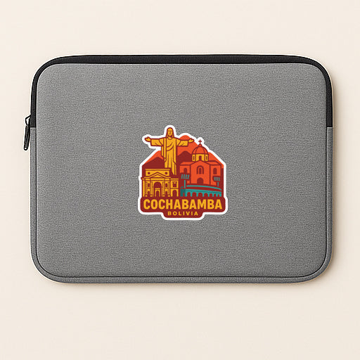 a gray laptop sleeve with a sticker of the city of Cochabamba, Bolivia.