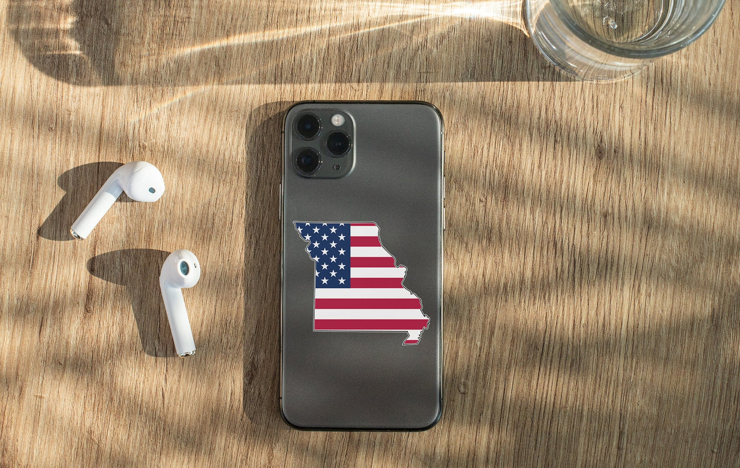 a cell phone with a sticker of the state of indiana