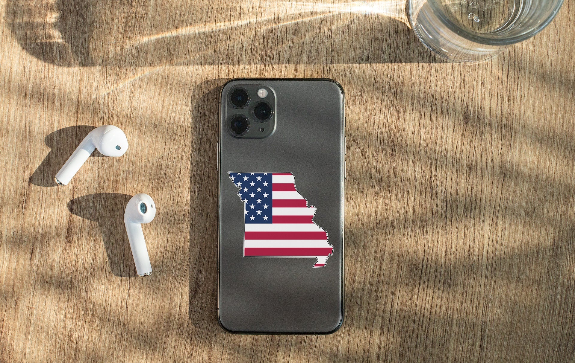 a cell phone with a sticker of the state of indiana