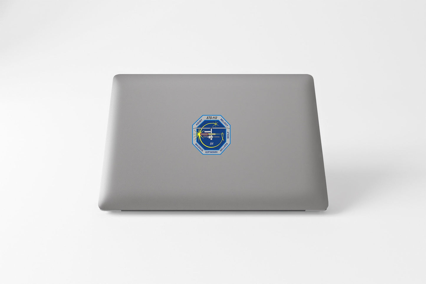 a laptop computer with a sticker on it