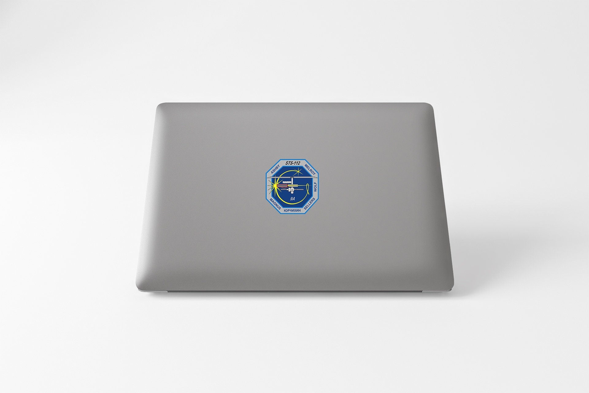 a laptop computer with a sticker on it