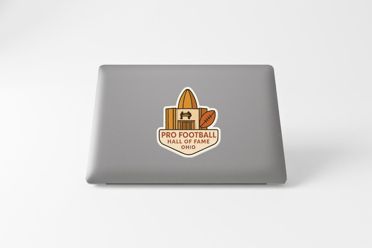 a sticker on the back of a laptop that says "PRO FOOTBALL HALL OF FAME OHIO".