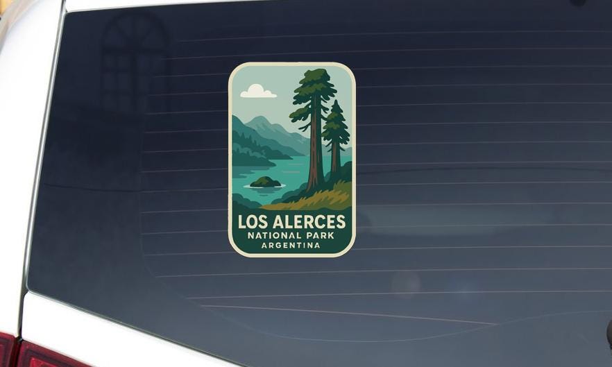 A sticker on the rear window of a vehicle that says "LOS ALERCES NATIONAL PARK ARGENTINA".