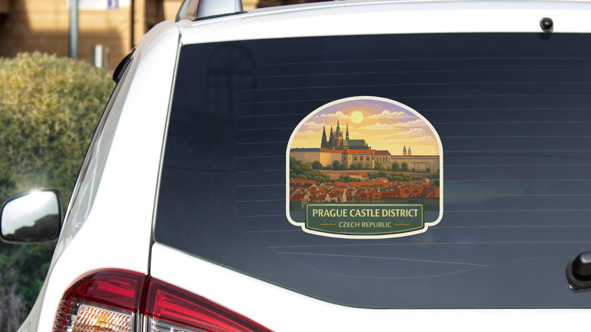 A sticker on the rear window of a car, depicting the Prague Castle District in the Czech Republic.