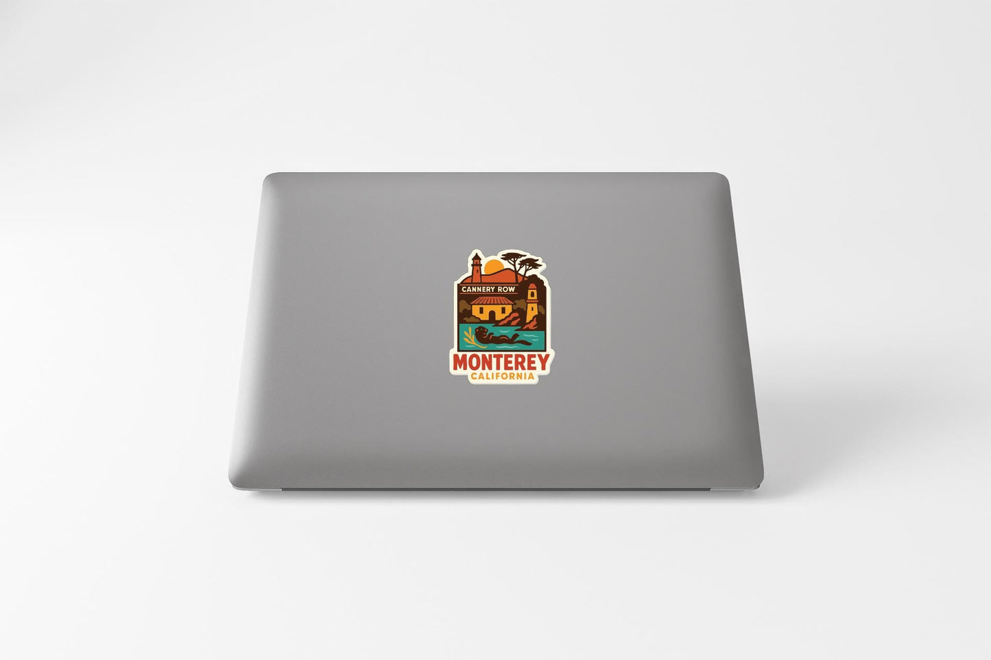 a sticker with a graphic design on the back of a laptop.
