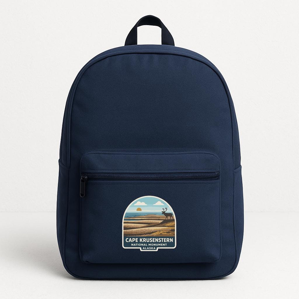 A navy blue backpack with a graphic of Cape Krusen Sterien National Park on the front.