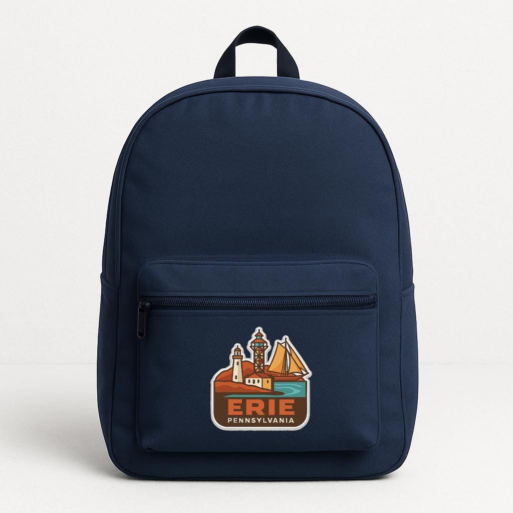 A navy blue backpack with a graphic of a lighthouse and the text "ERIE PENNSYLVANIA" printed on it.