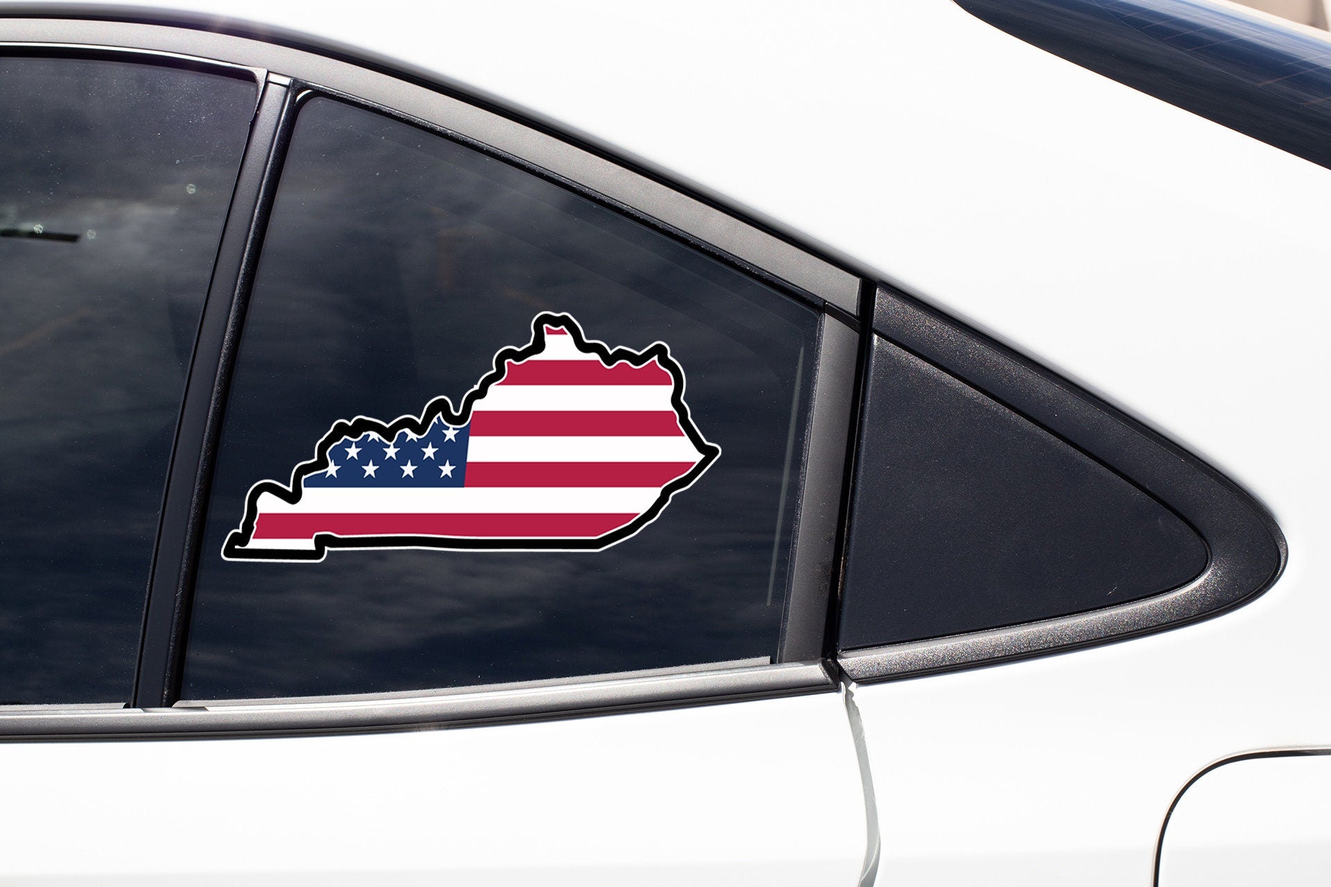 a car with a sticker of the state of michigan on it