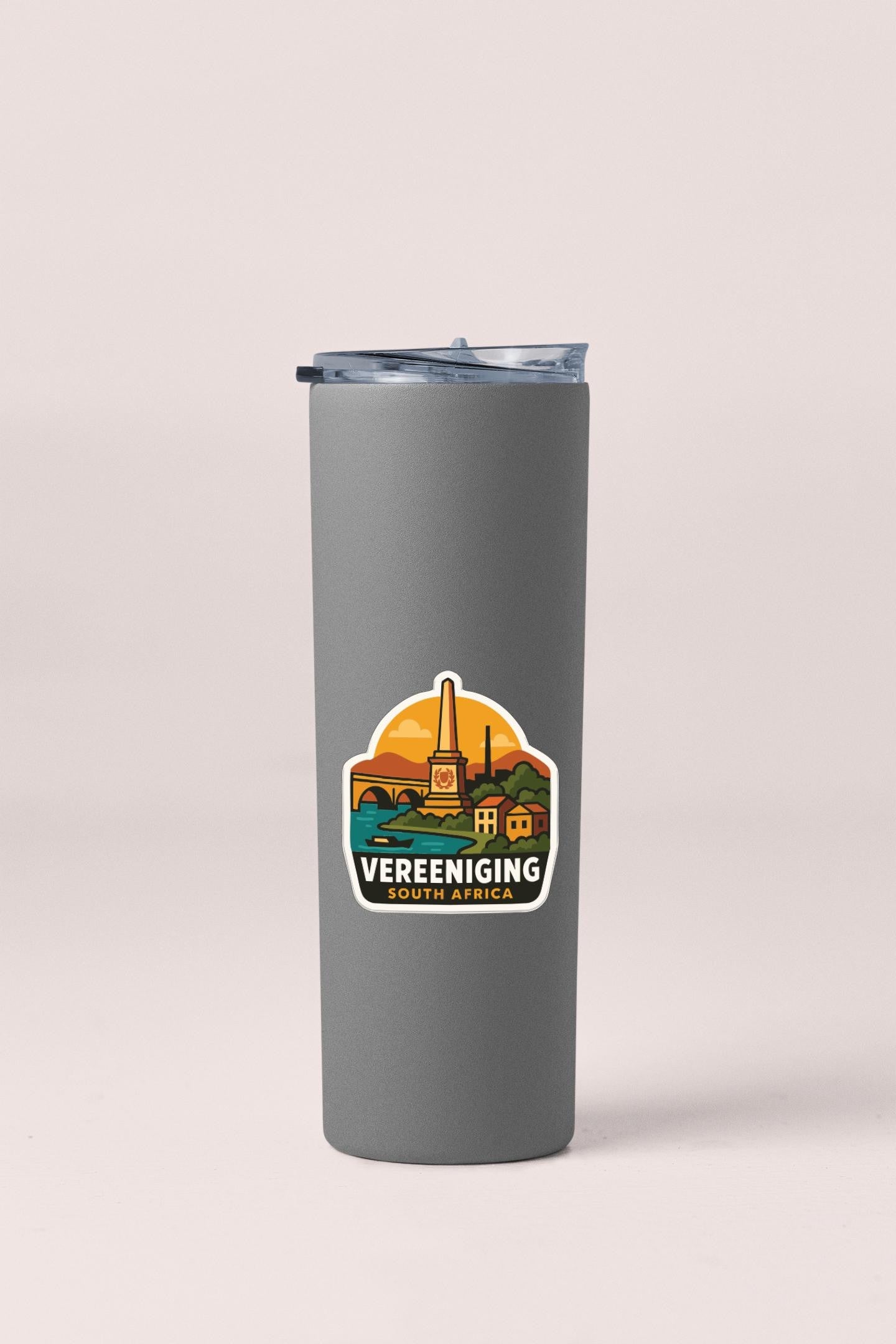 A gray insulated tumbler with a sticker depicting a scenic landscape and the text "Vereeniging South Africa".