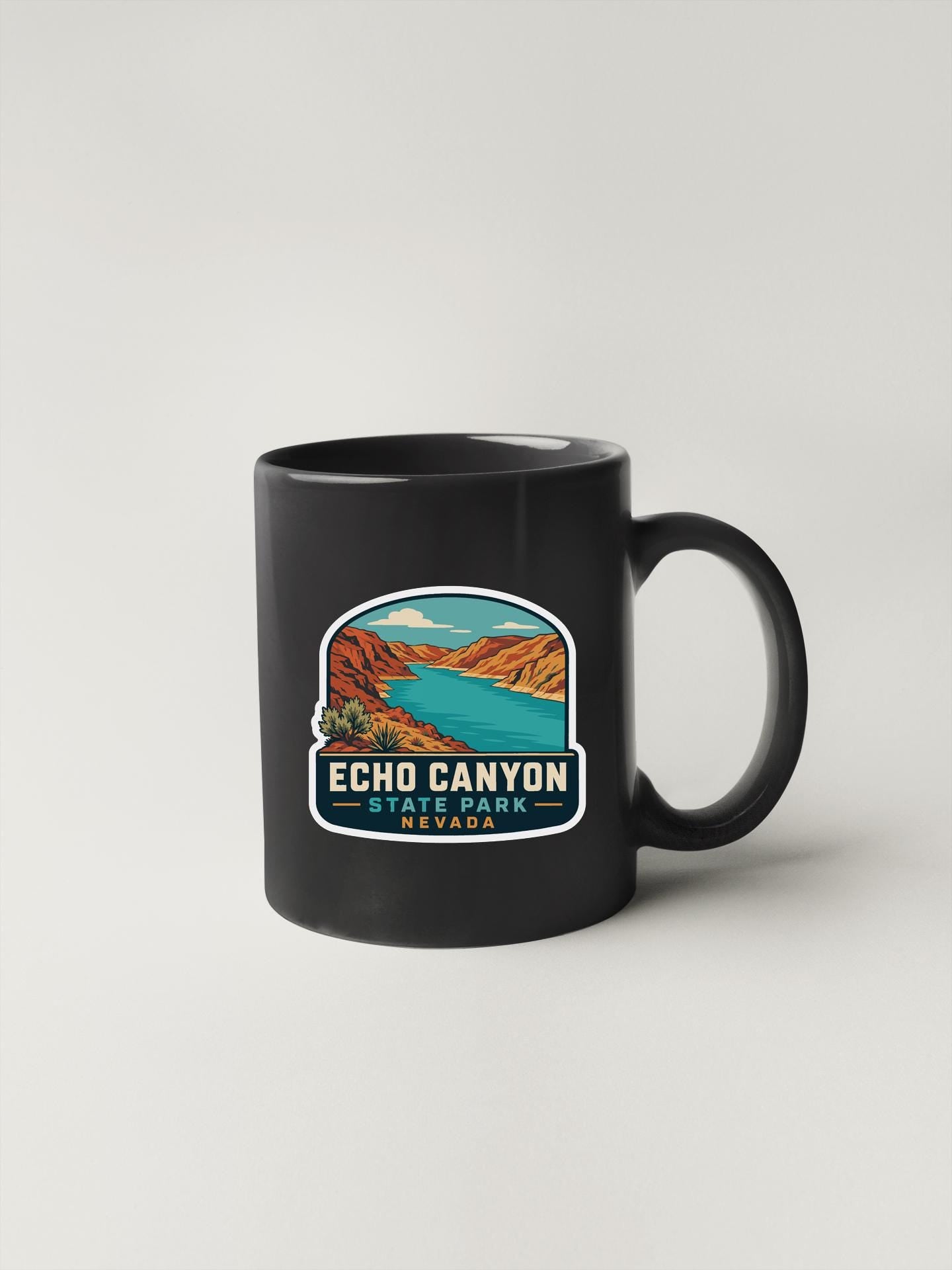 A black coffee mug with a graphic design depicting the Echo Canyon State Park in Nevada.