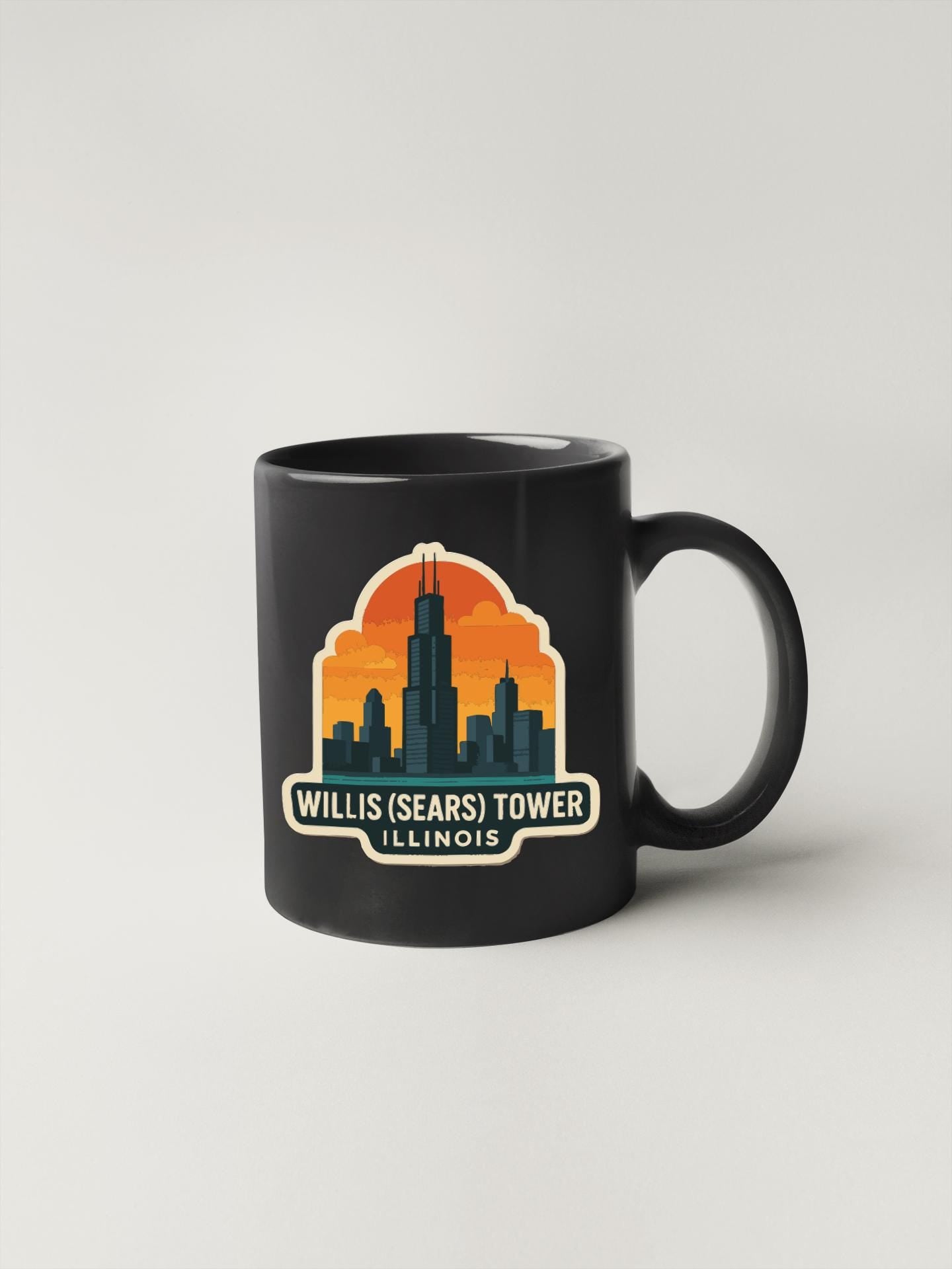 A black coffee mug with a graphic design featuring the Willis (Sears) Tower in Illinois.