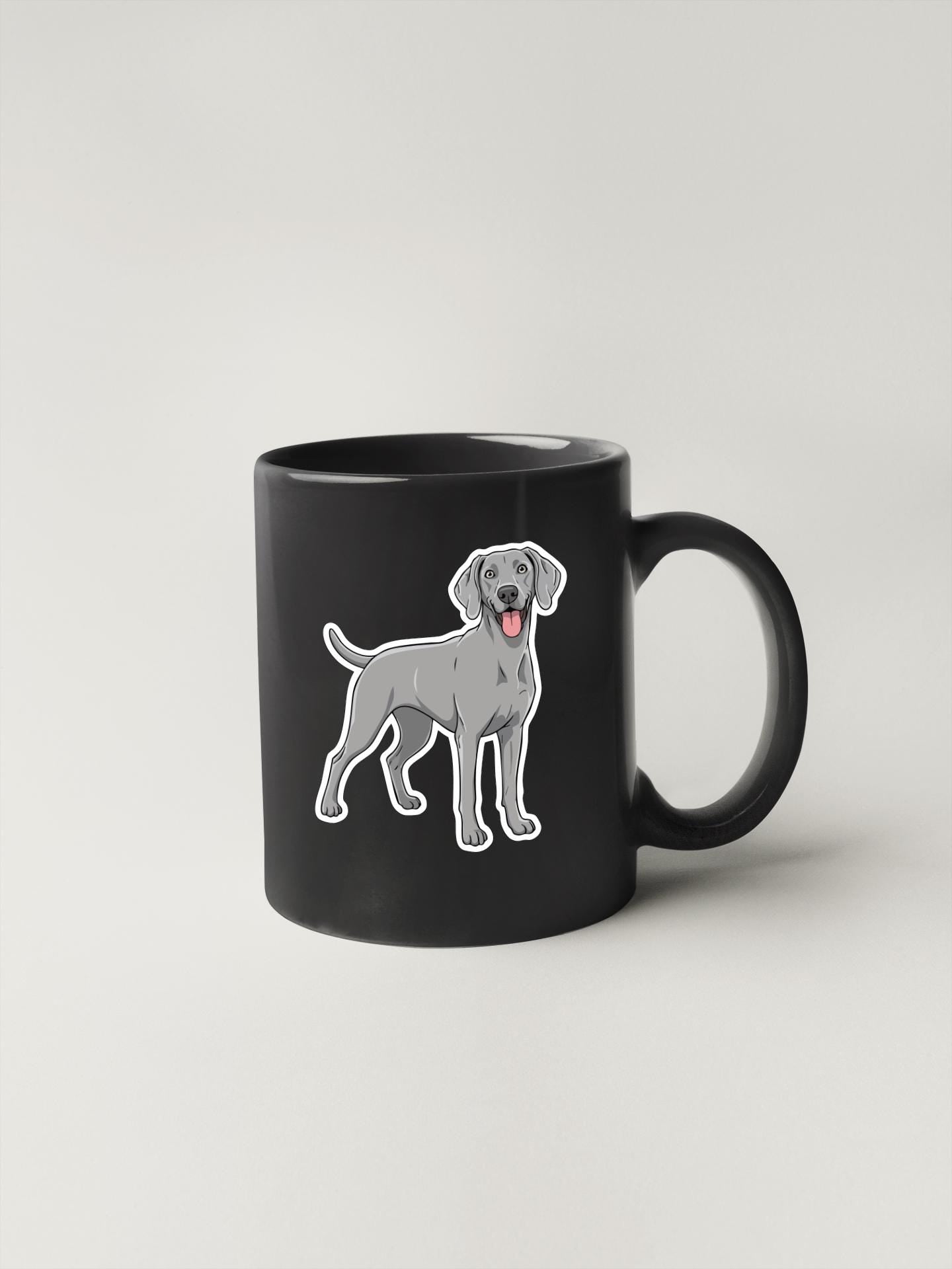 A black coffee mug with a cartoon illustration of a dog on it.