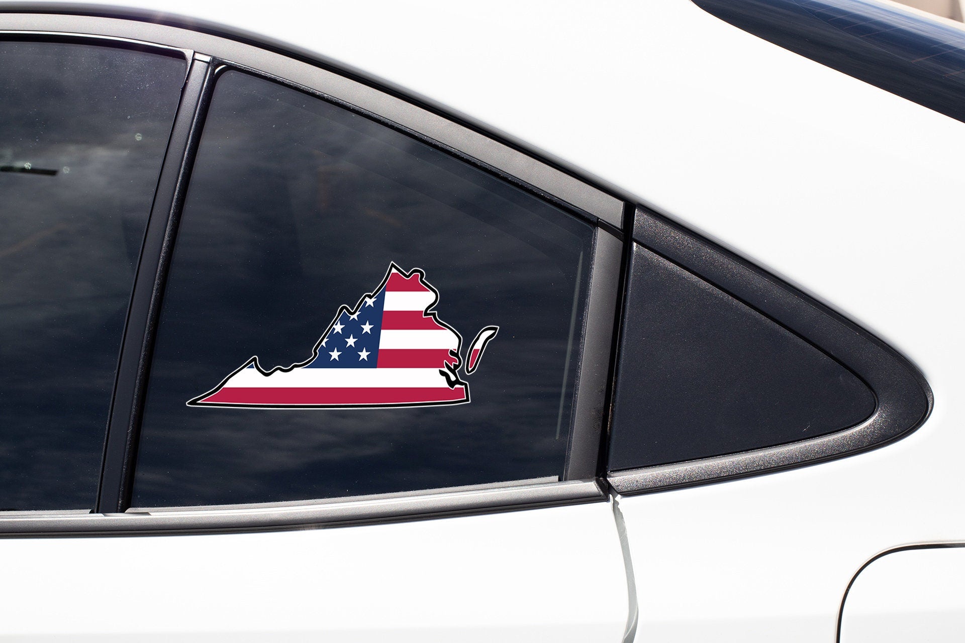 a car with a sticker of the state of maine on it