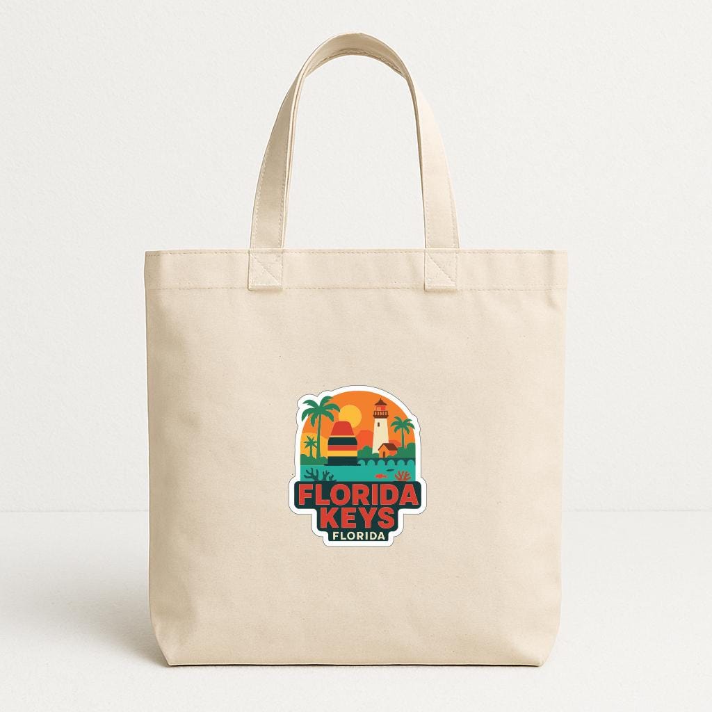 A beige tote bag with a graphic design featuring a lighthouse and palm trees, along with the text "FLORIDA KEYS FLORIDA".