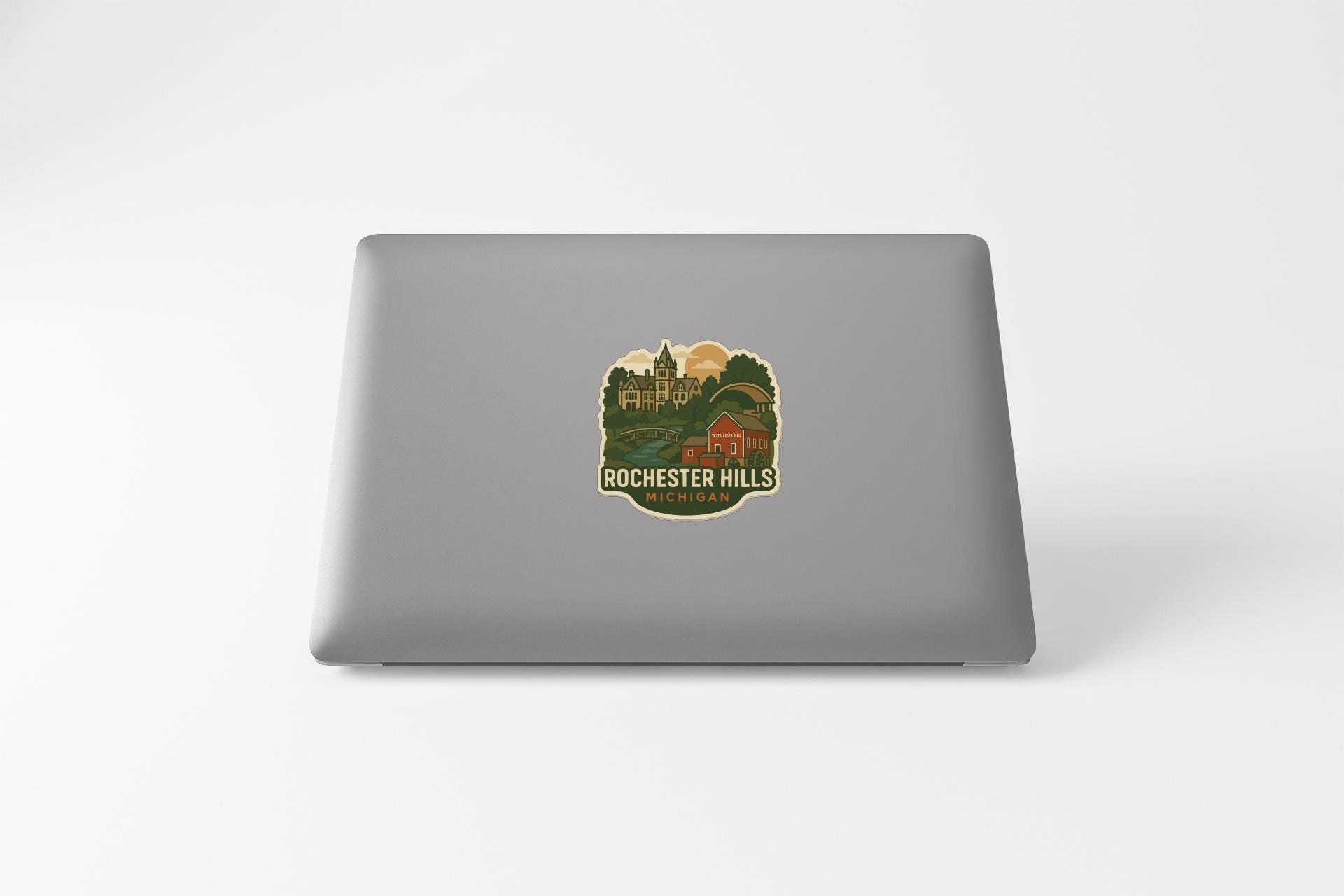 a sticker with a scenic landscape on a laptop.