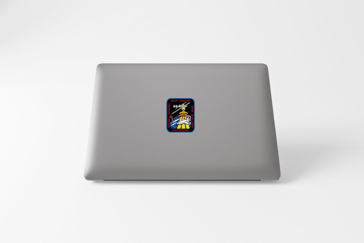 a laptop computer with a sticker of a cartoon character