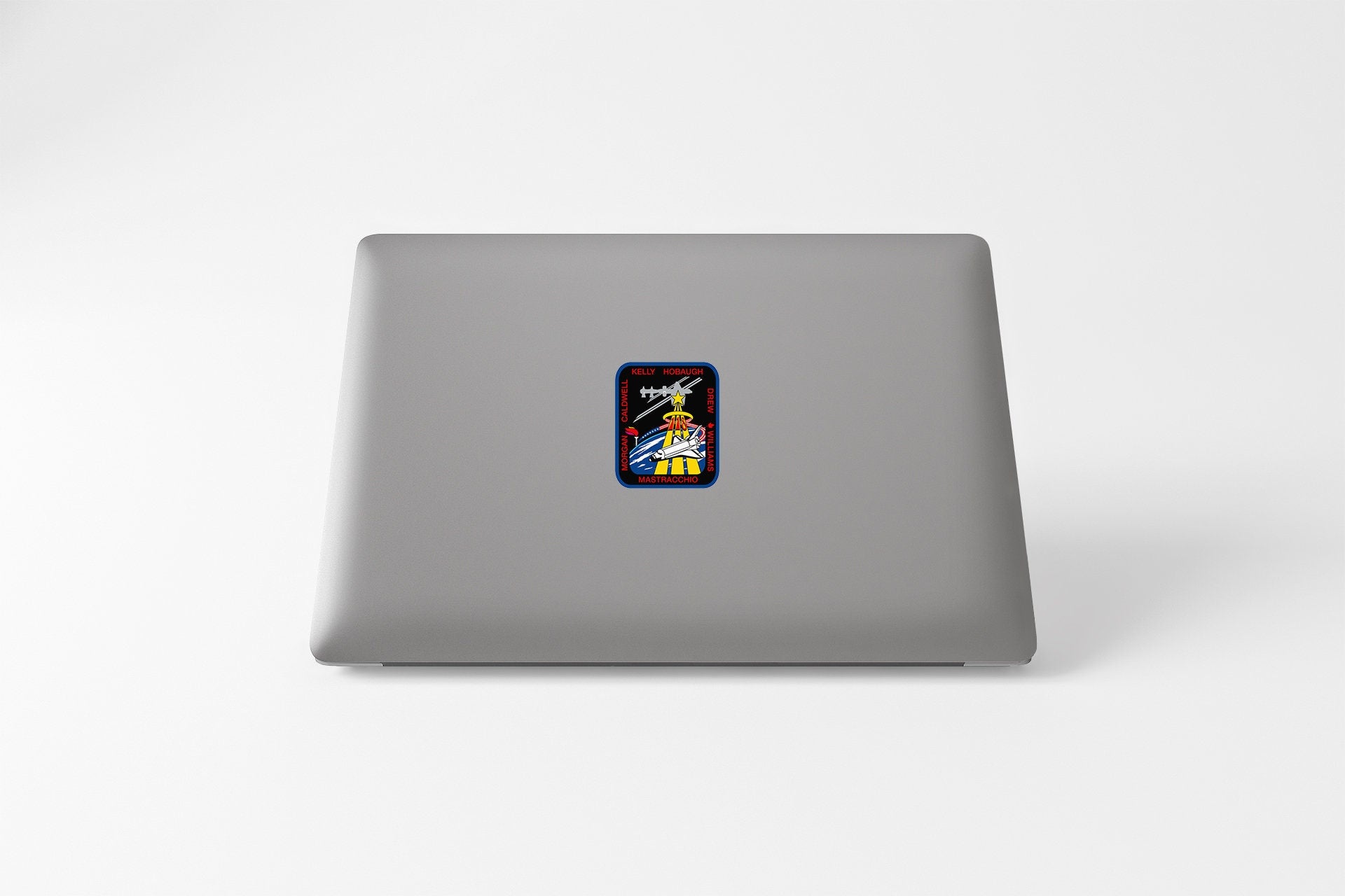 a laptop computer with a sticker of a cartoon character
