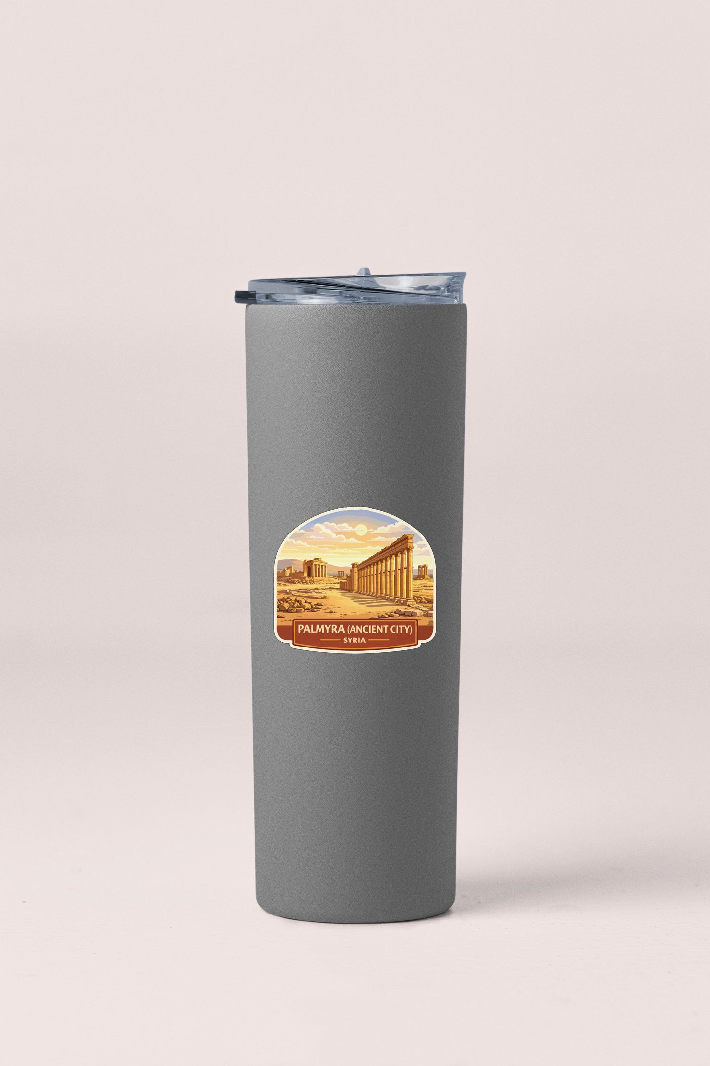 A gray insulated tumbler with a label depicting the Palmyra Ancient City in Syria.