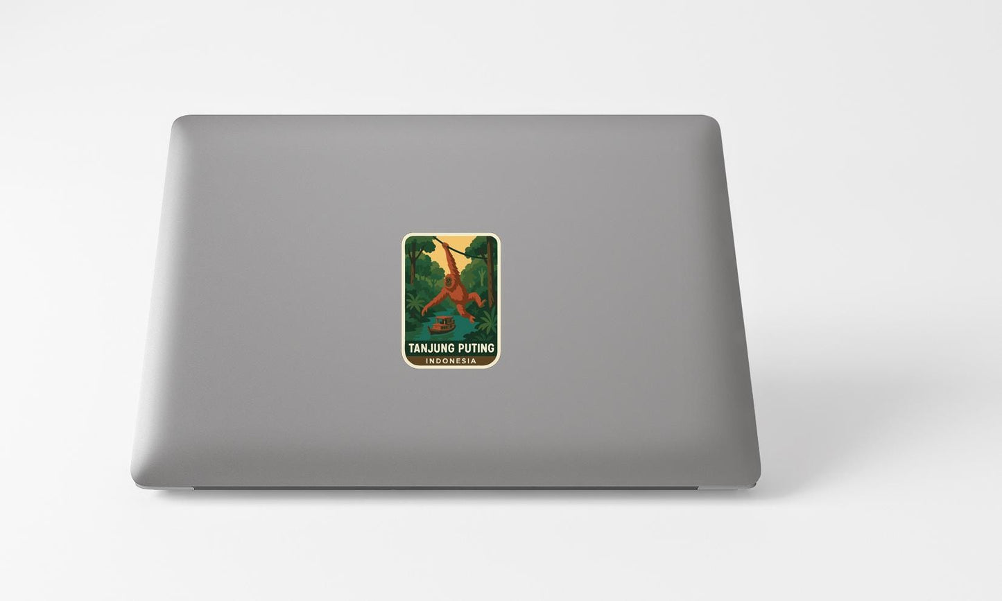 A sticker of a person swinging on a rope is placed on the back of a laptop computer.