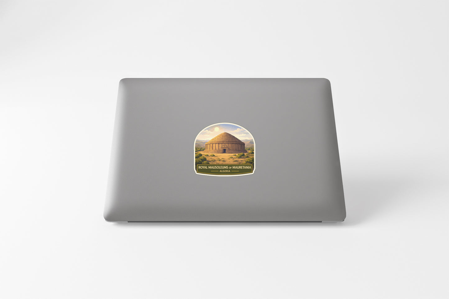 a sticker of a building on the back of a laptop.