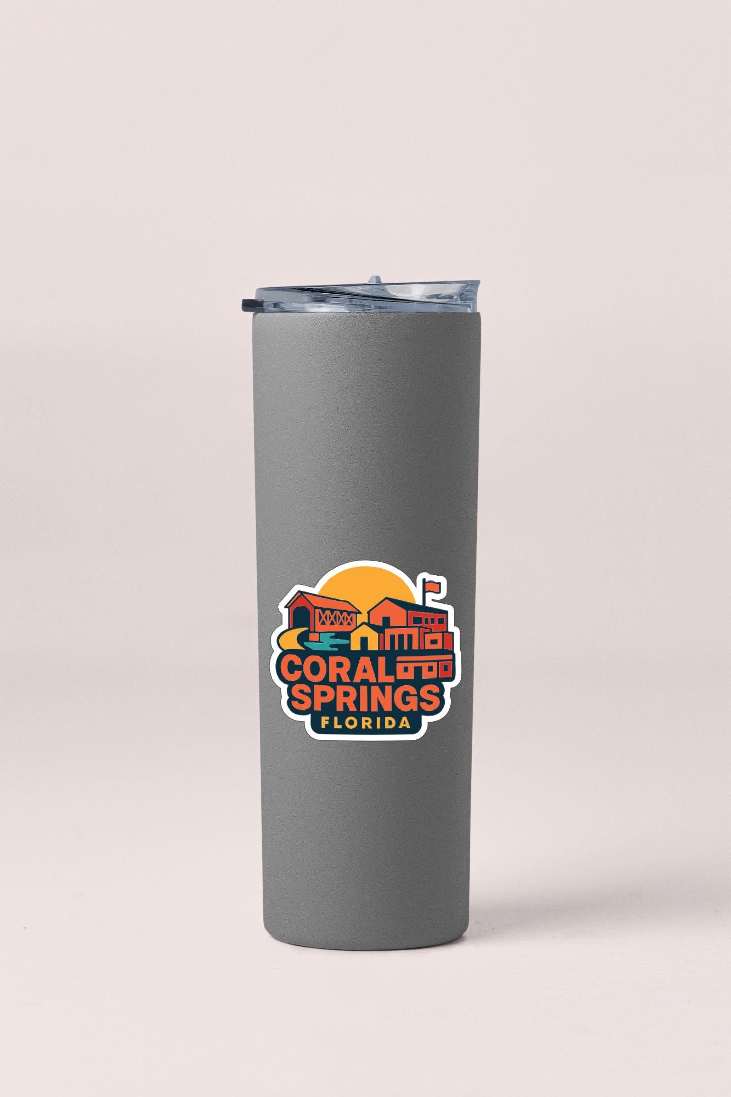 A gray insulated tumbler with a printed logo that says "Coral Springs, Florida".