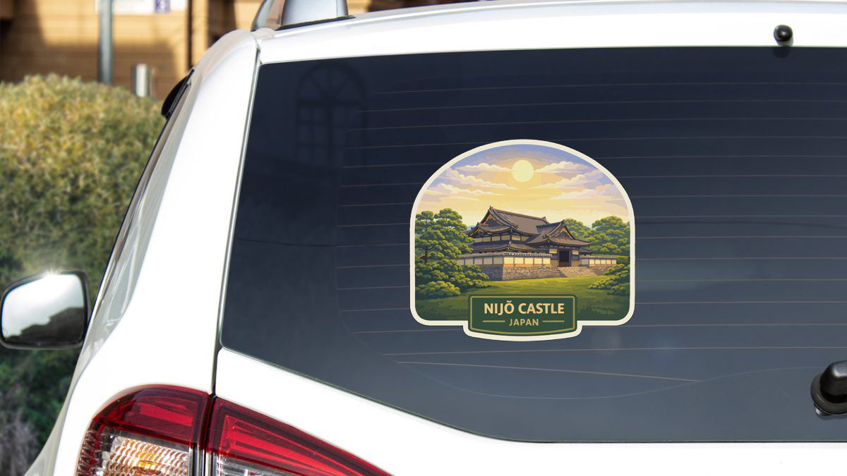 A sticker on the rear window of a car depicting the Nijo Castle in Japan.