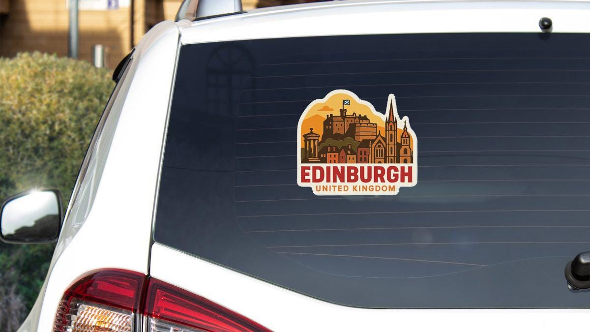 A sticker on the rear window of a car that says "EDINBURGH UNITED KINGDOM".