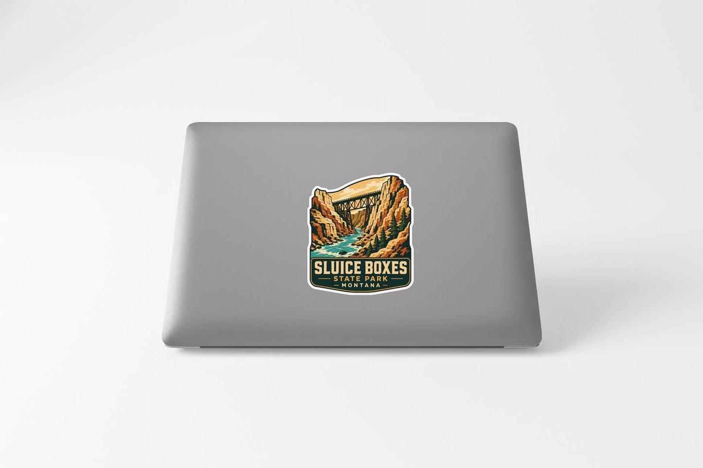 a sticker on a laptop that says "SLUICE BOXES STATE PARK MONTANA".