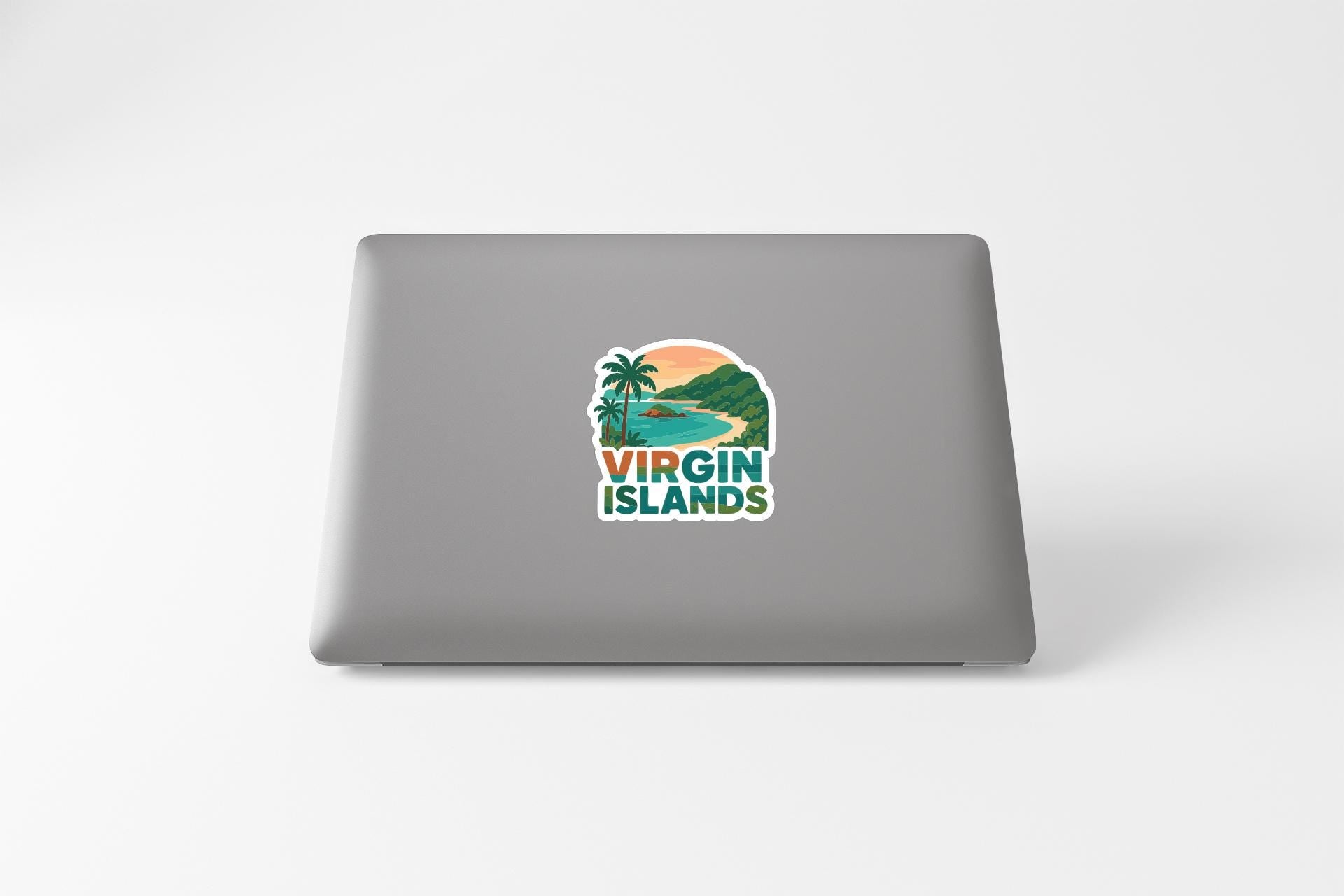 a sticker with a tropical island landscape and the text "VIRGIN ISLANDS" on the back of a laptop.