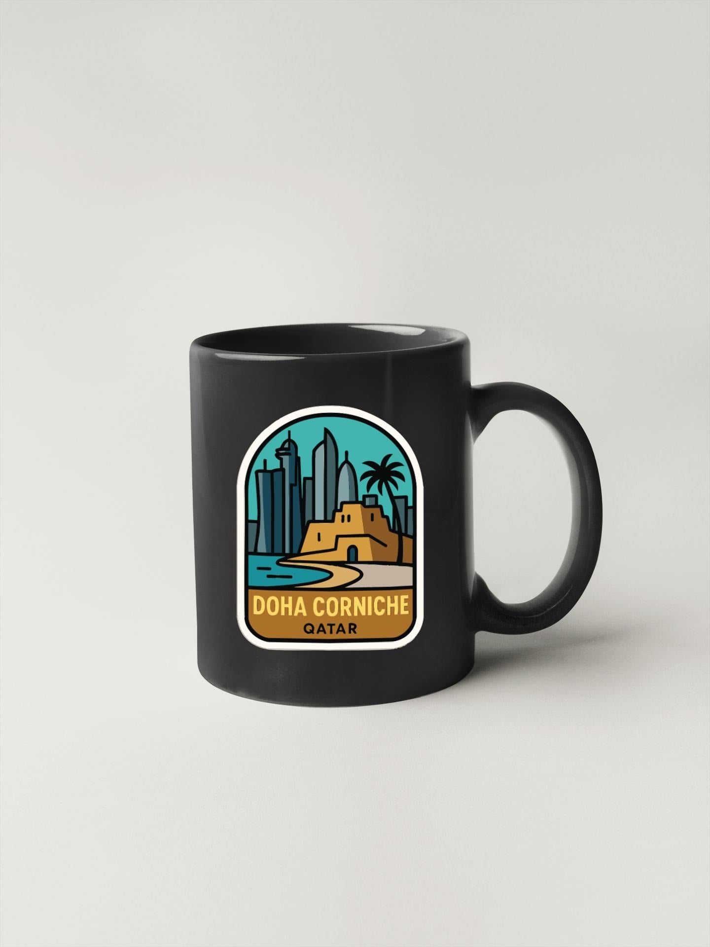 A black coffee mug with a sticker depicting the cityscape of Doha, Qatar.