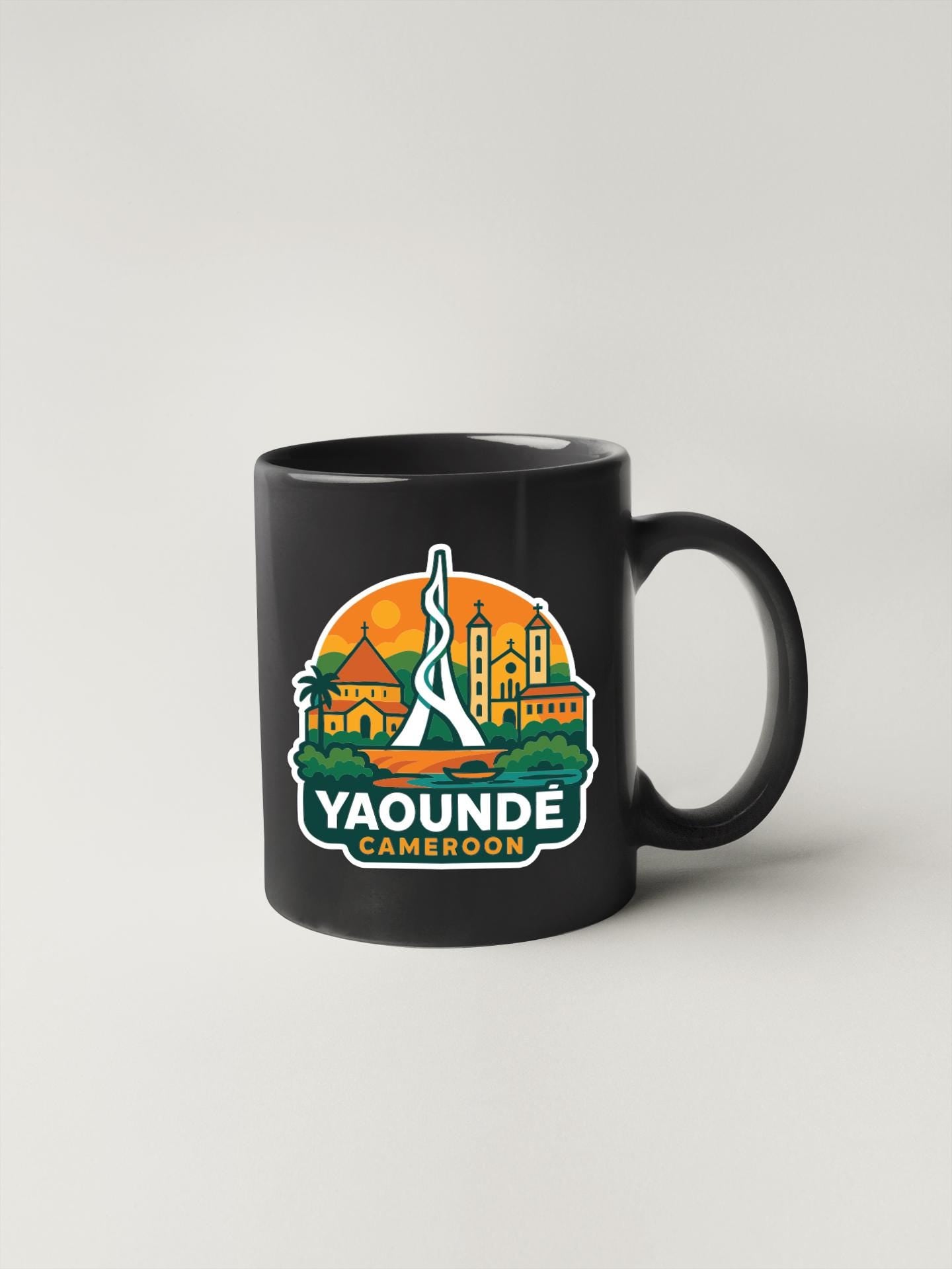 A black coffee mug with a colorful graphic design depicting the city of Yaounde, the capital city of the Republic of the Congo.