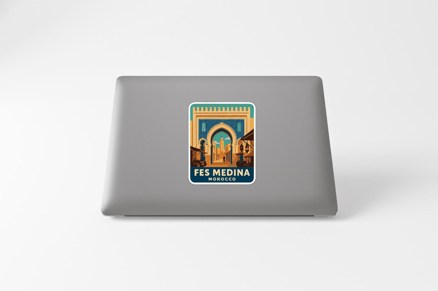 a sticker with an illustration of a building, likely representing the Fes Medina in Morocco.