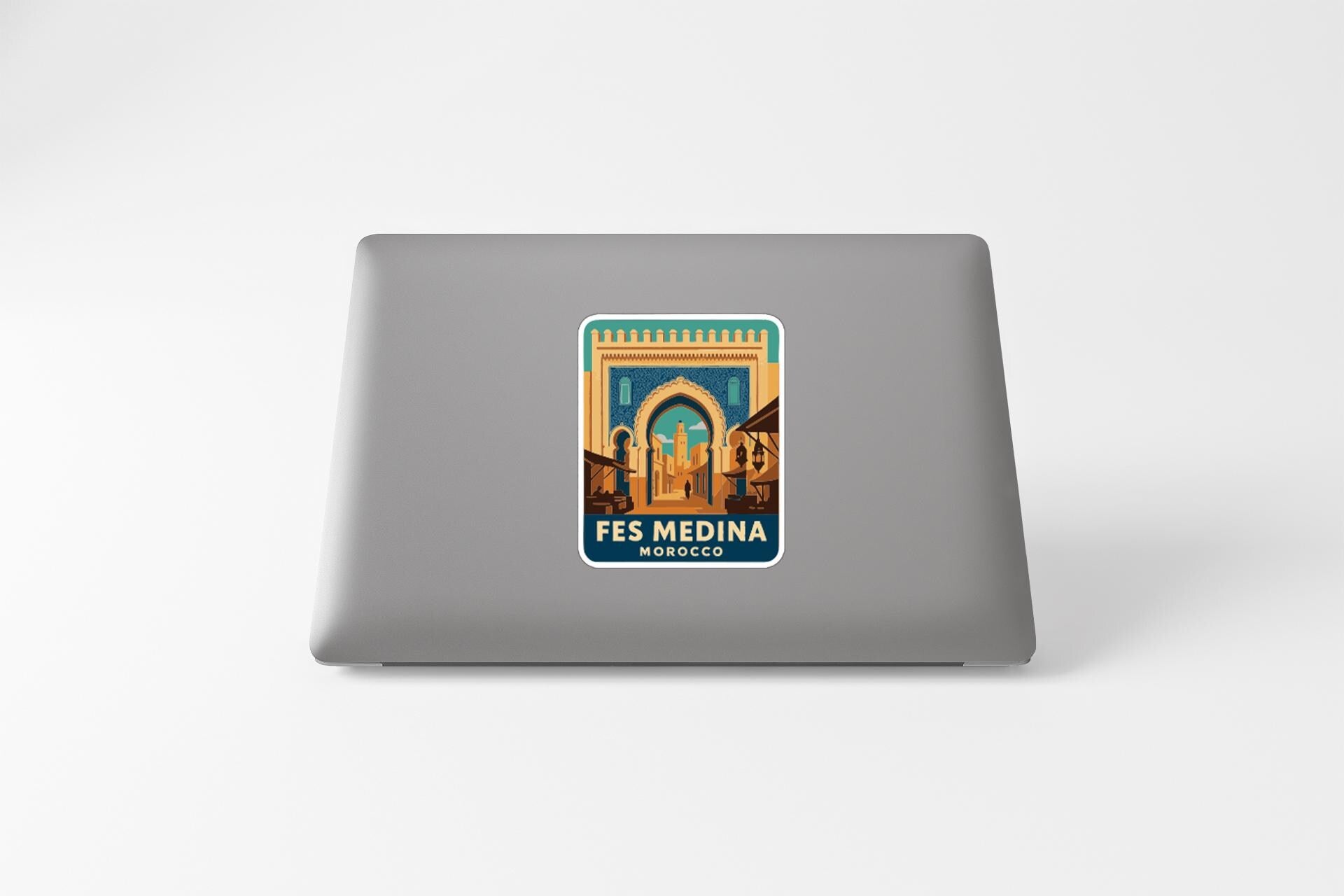 a sticker with an illustration of a building, likely representing the Fes Medina in Morocco.