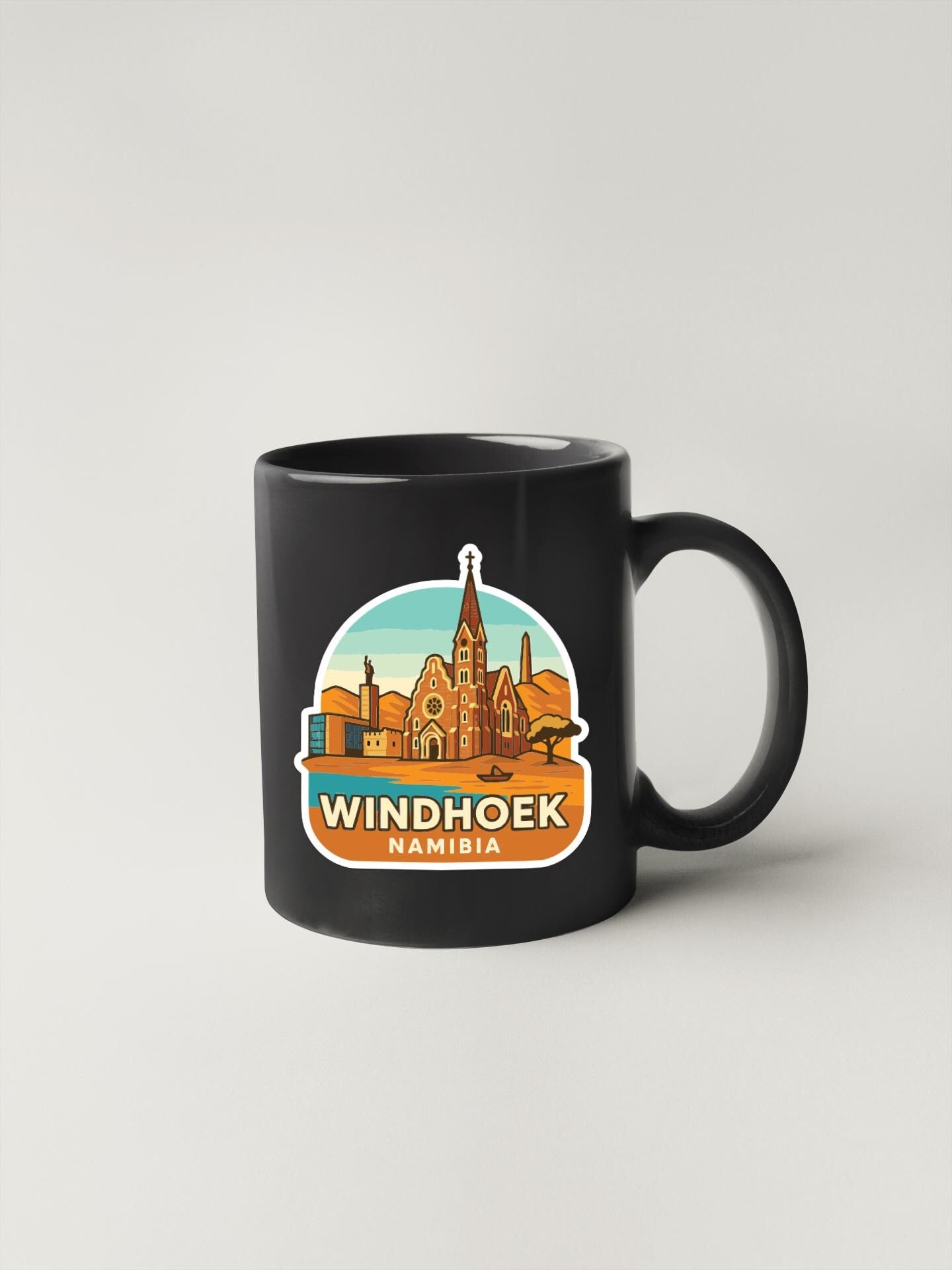 A black coffee mug with a graphic design depicting the Windhoek skyline in Namibia.