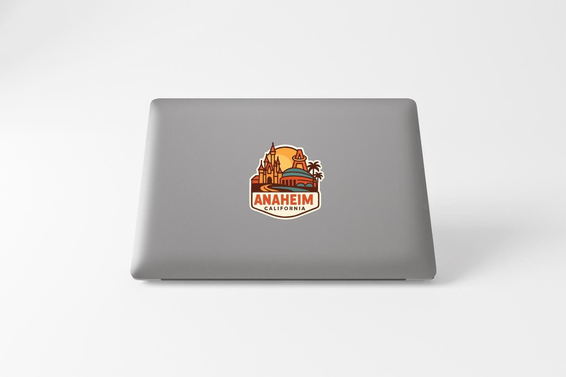 a sticker with a graphic of a castle and palm trees, along with the text "ANAHIMA, CALIFORNIA".