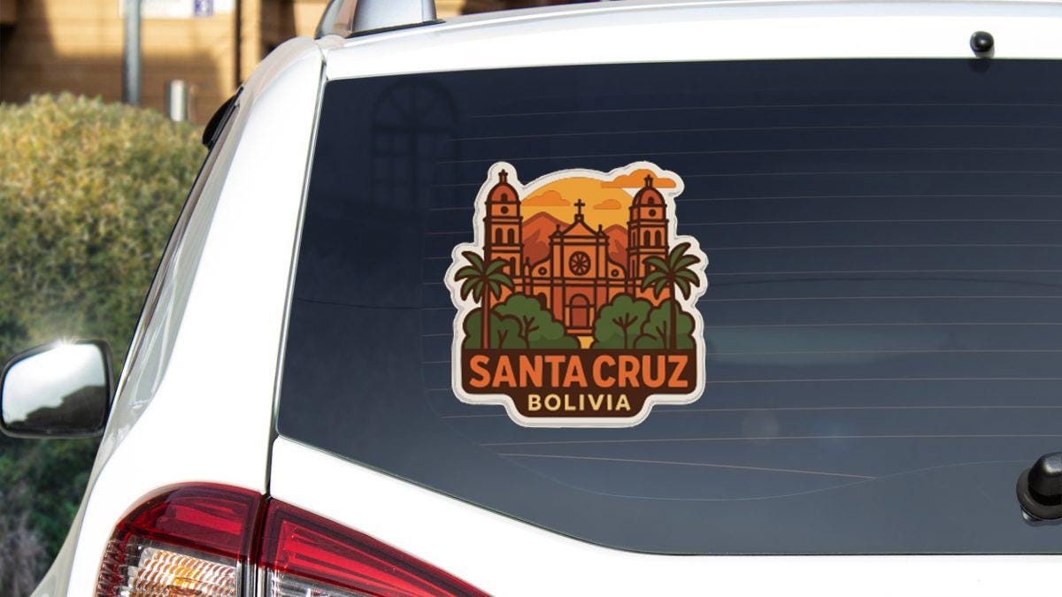 A sticker on the rear window of a car that features an illustration of Santa Cruz, Bolivia.