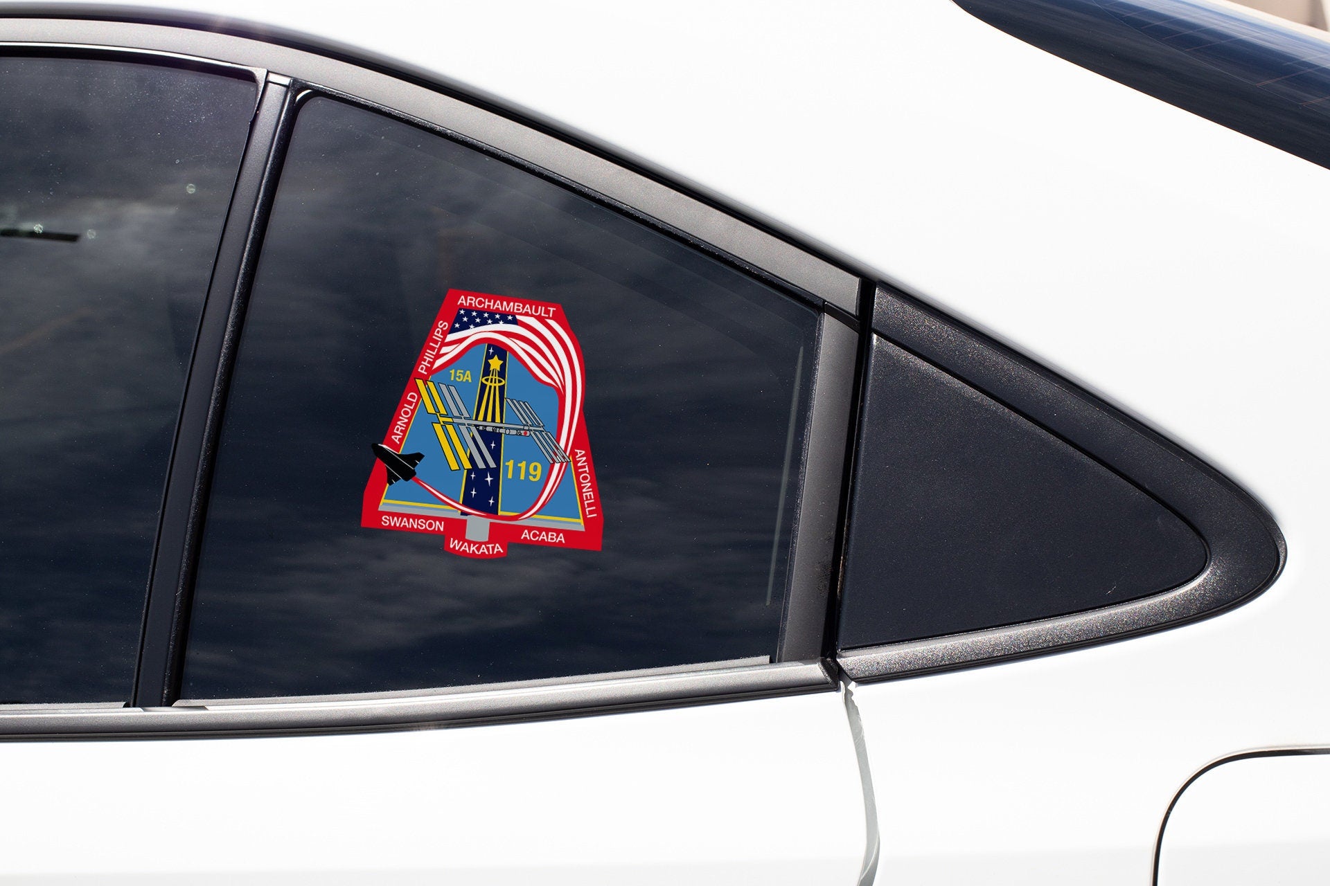 a sticker on the side of a white car