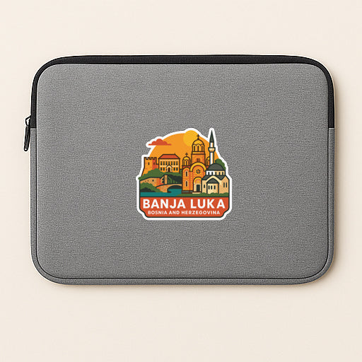 a gray laptop sleeve with a sticker depicting a cityscape and the text "BANJA LUKA" printed on it.