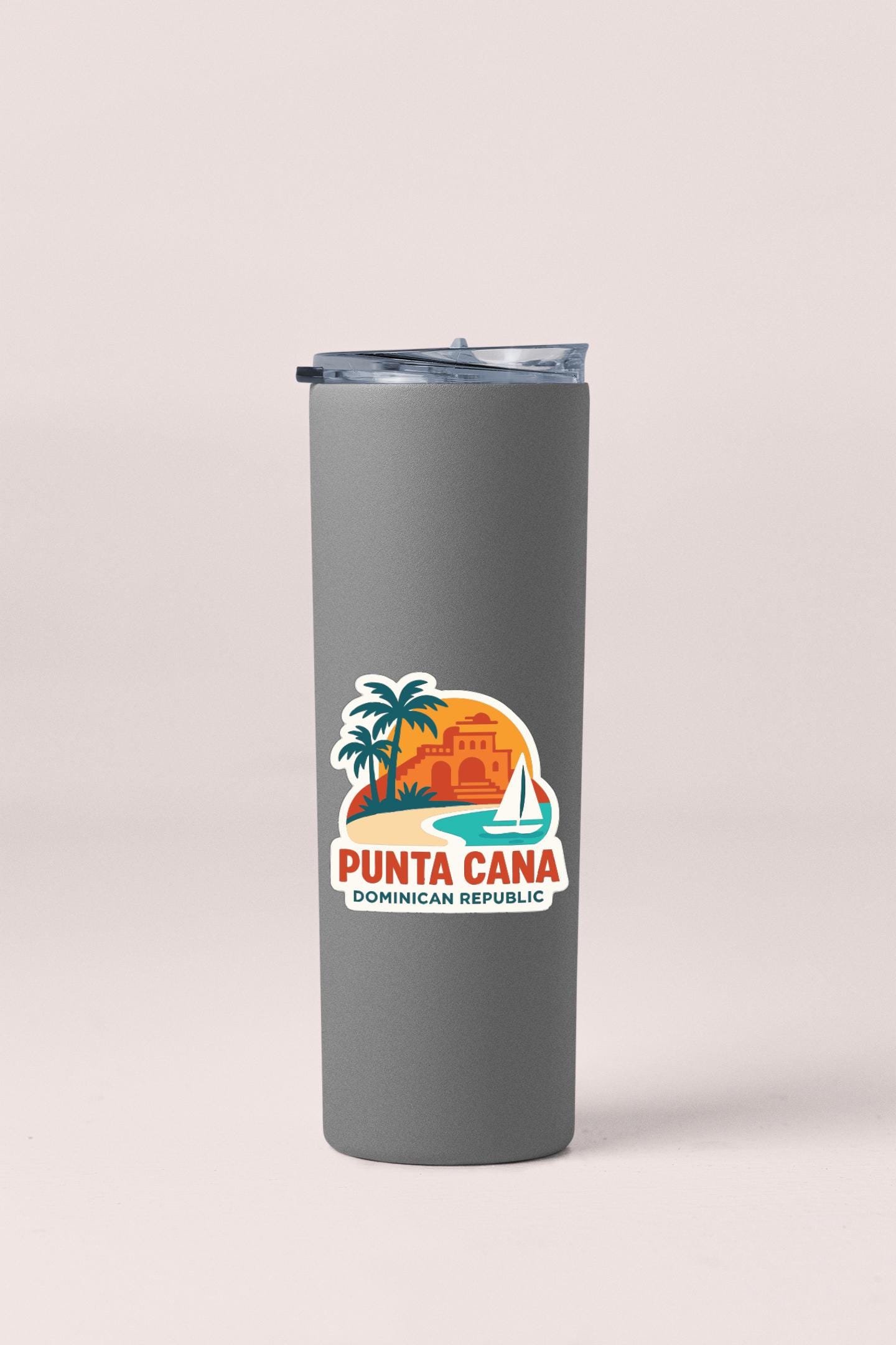A gray insulated tumbler with a sticker depicting a tropical island and palm trees, along with the text "Punta Cana Dominican Republic".